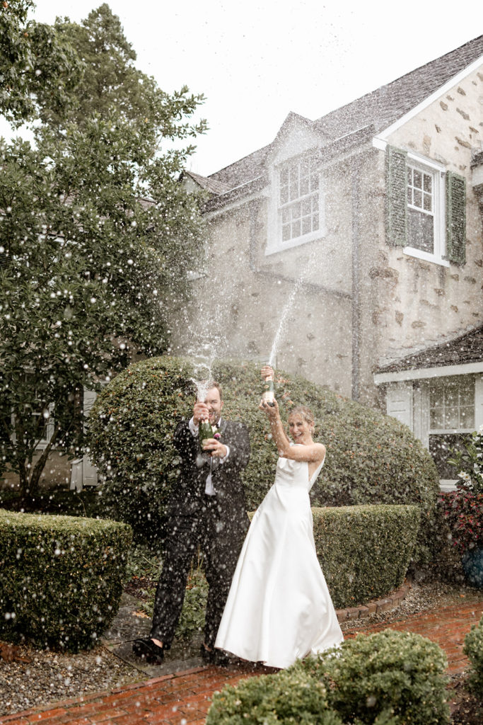 bride and groom champagne spray