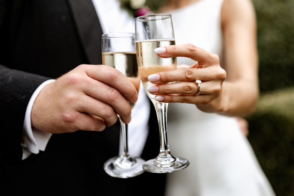 wedding bride and groom cheers wedding glasses